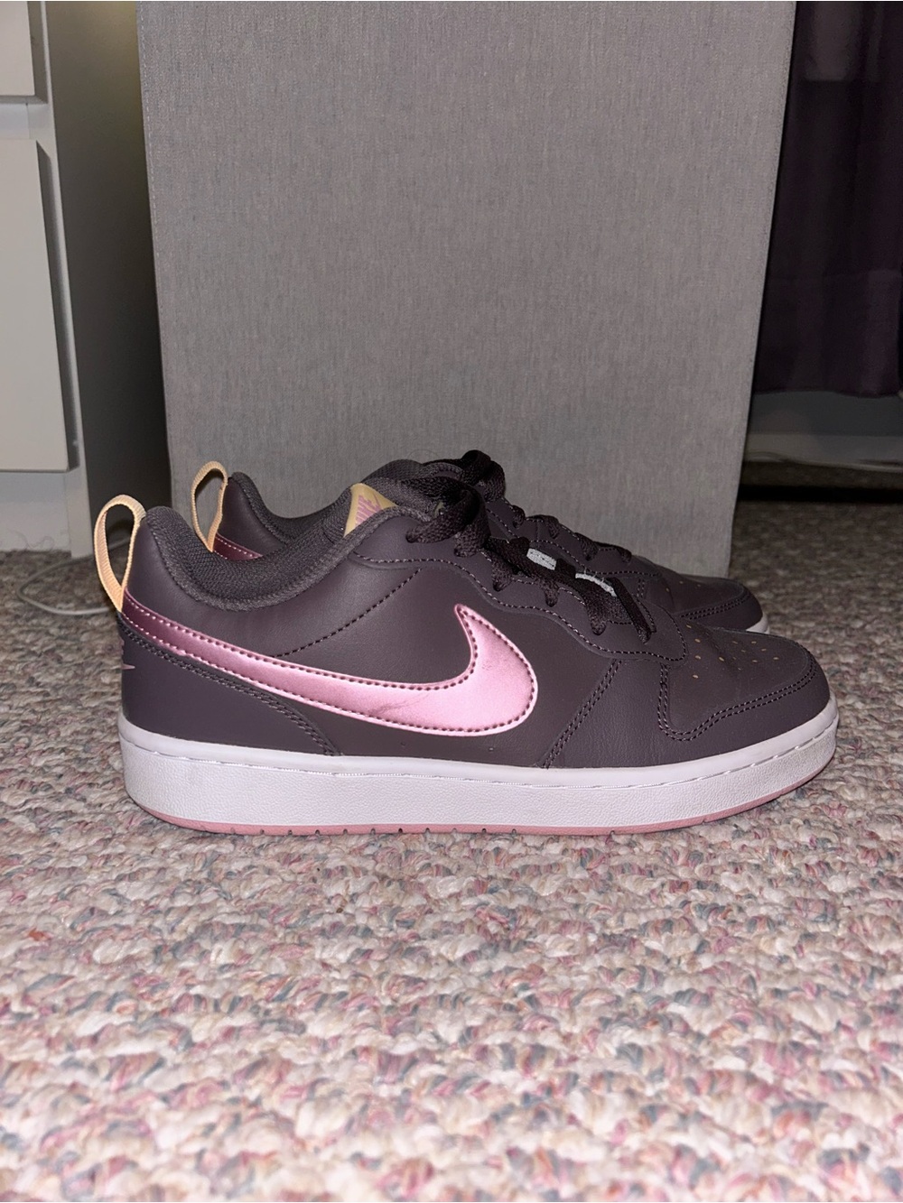 Nike Low-Top Sneakers in Dark Brown with Metallic Pink Swoosh